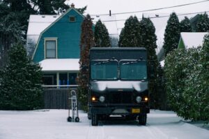 Delivery truck in snow to show how you need Seattle fleet management for winter