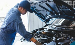 mechanic maintaining vehicle for Houston fleet management