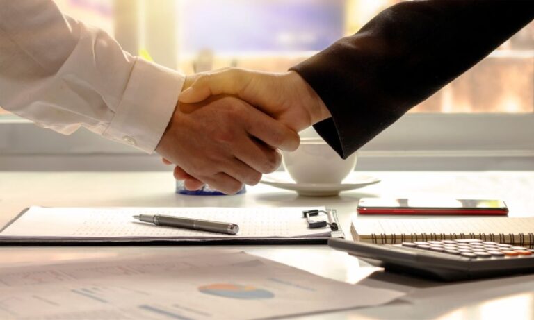 business people shaking hands for commercial vehicle leasing agreement